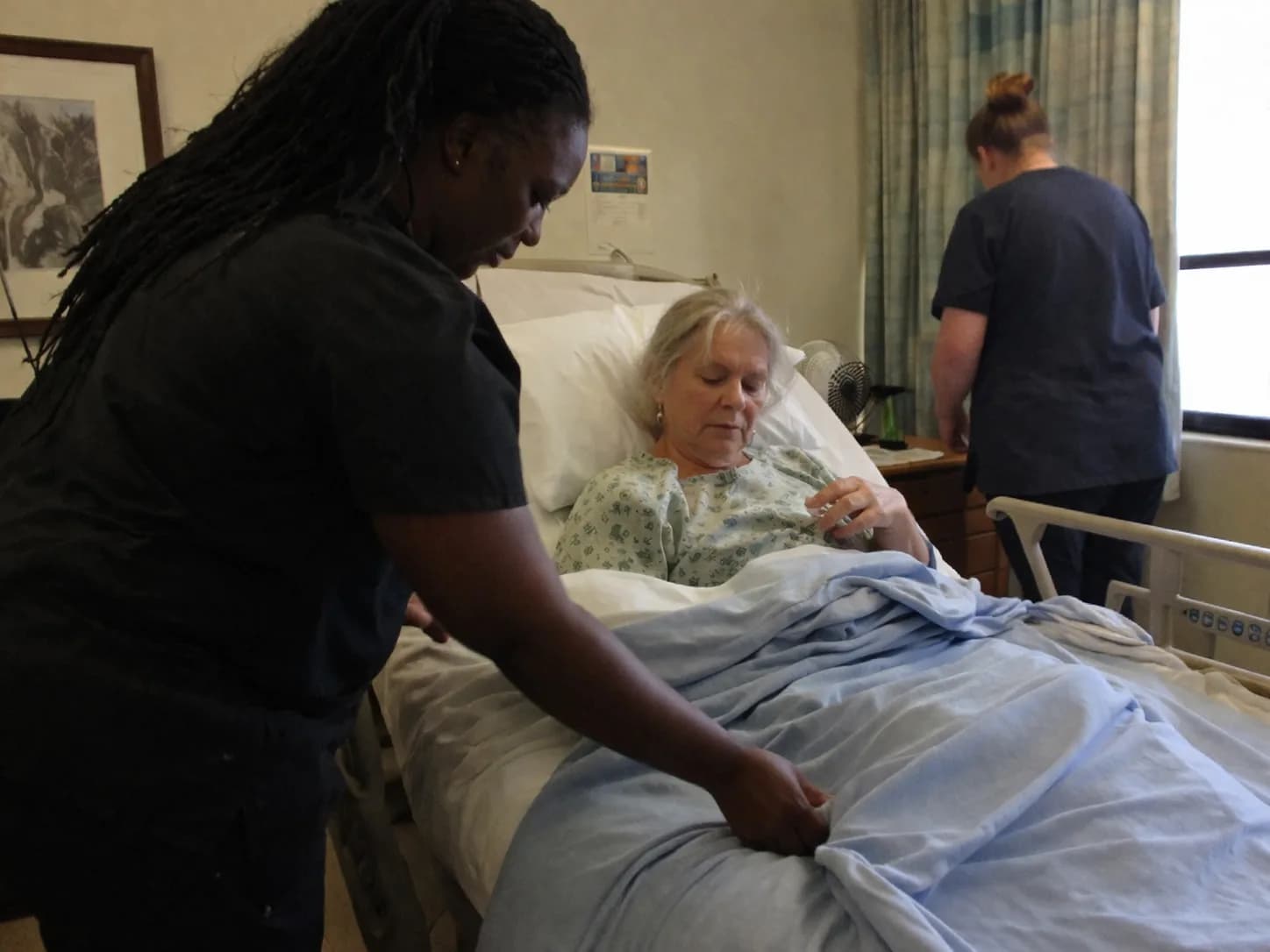 Clinician helping an older adult at home